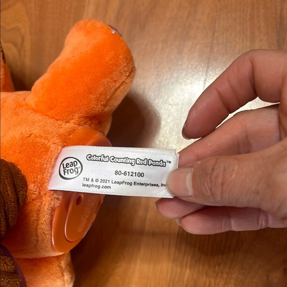 Orange and Blue Stuffed Raccoon Toy with Cartoonish Design - Picture 7 of 8